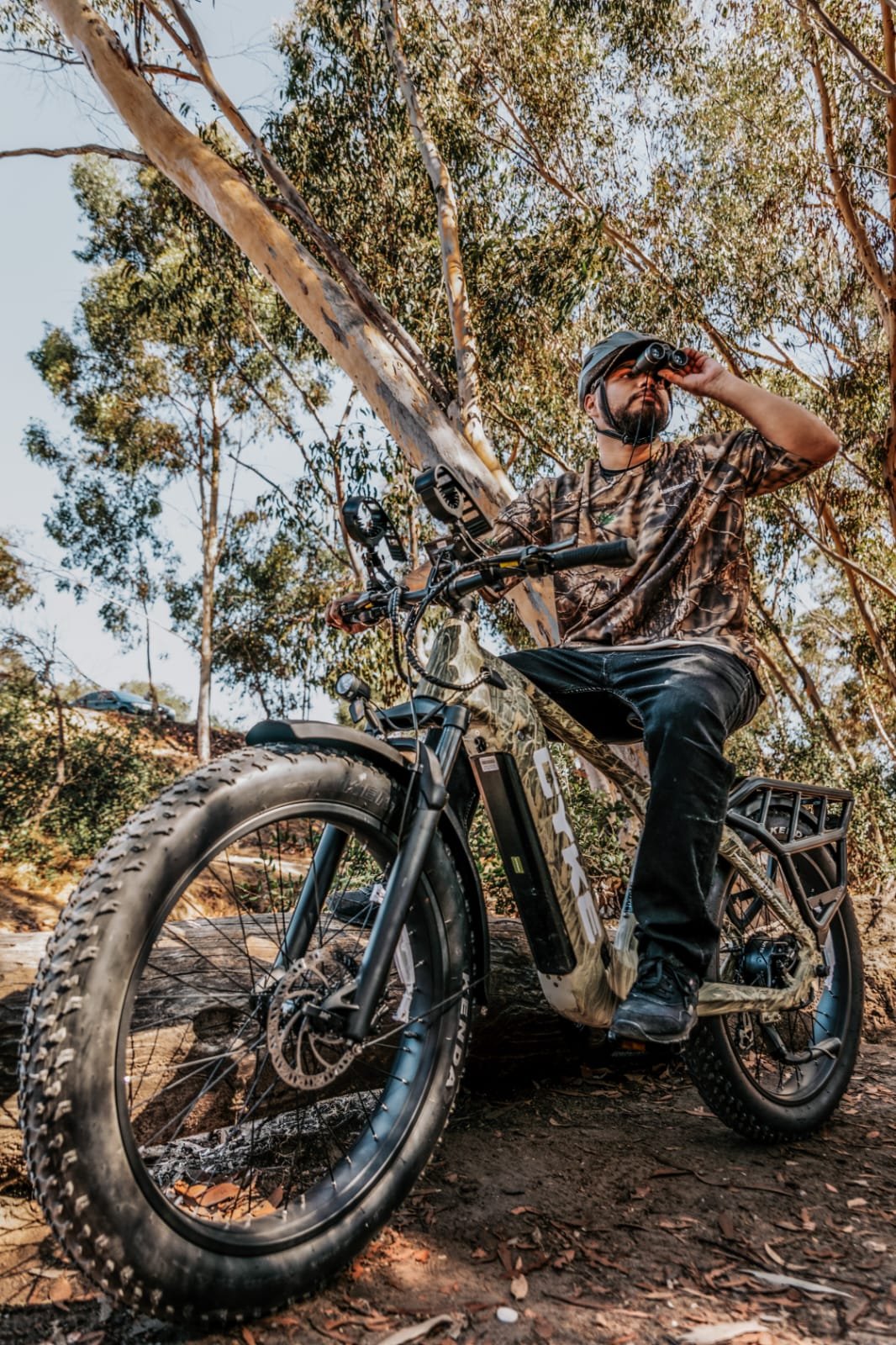 Full suspension EMTB undergoing maintenance with tools and lubricants.